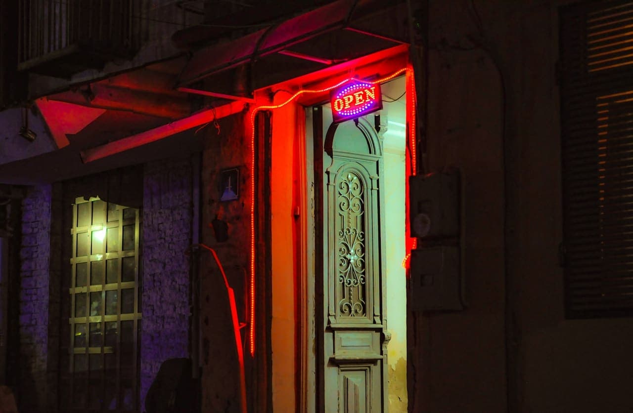 Lit doorway at night — 24/7 emergency availability