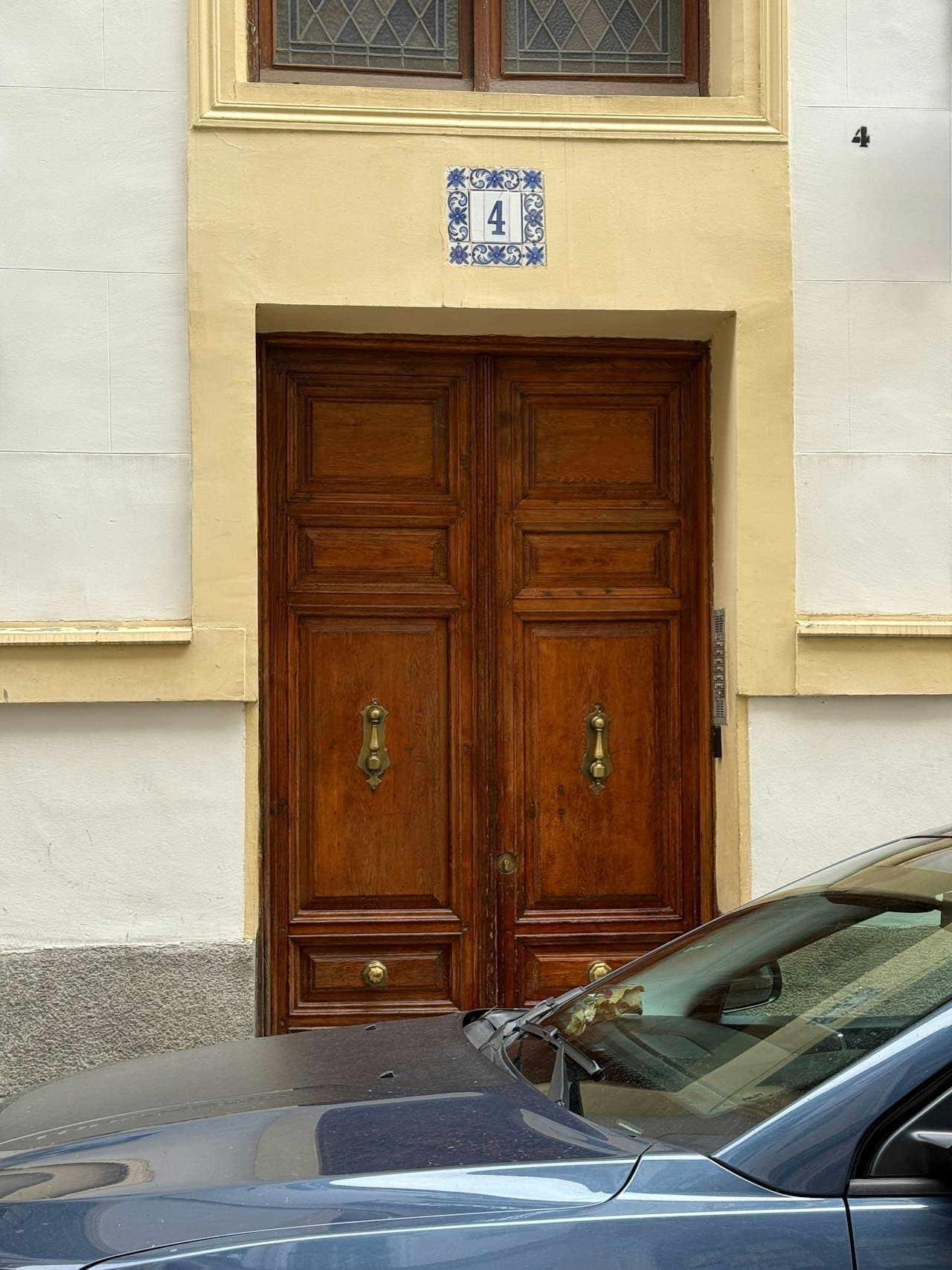 Wooden double doors with brass hardware