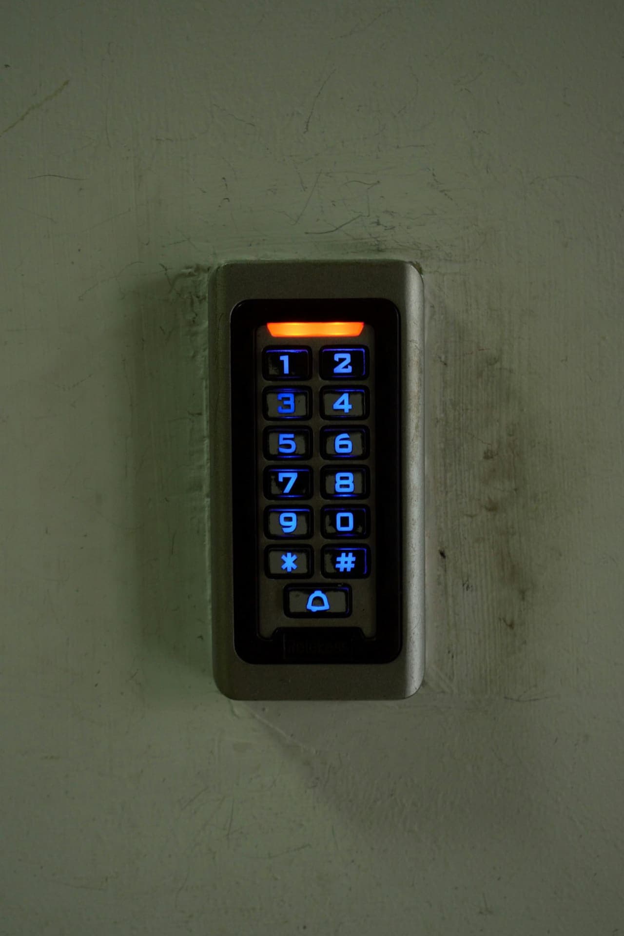 Backlit keypad access control on a building entrance